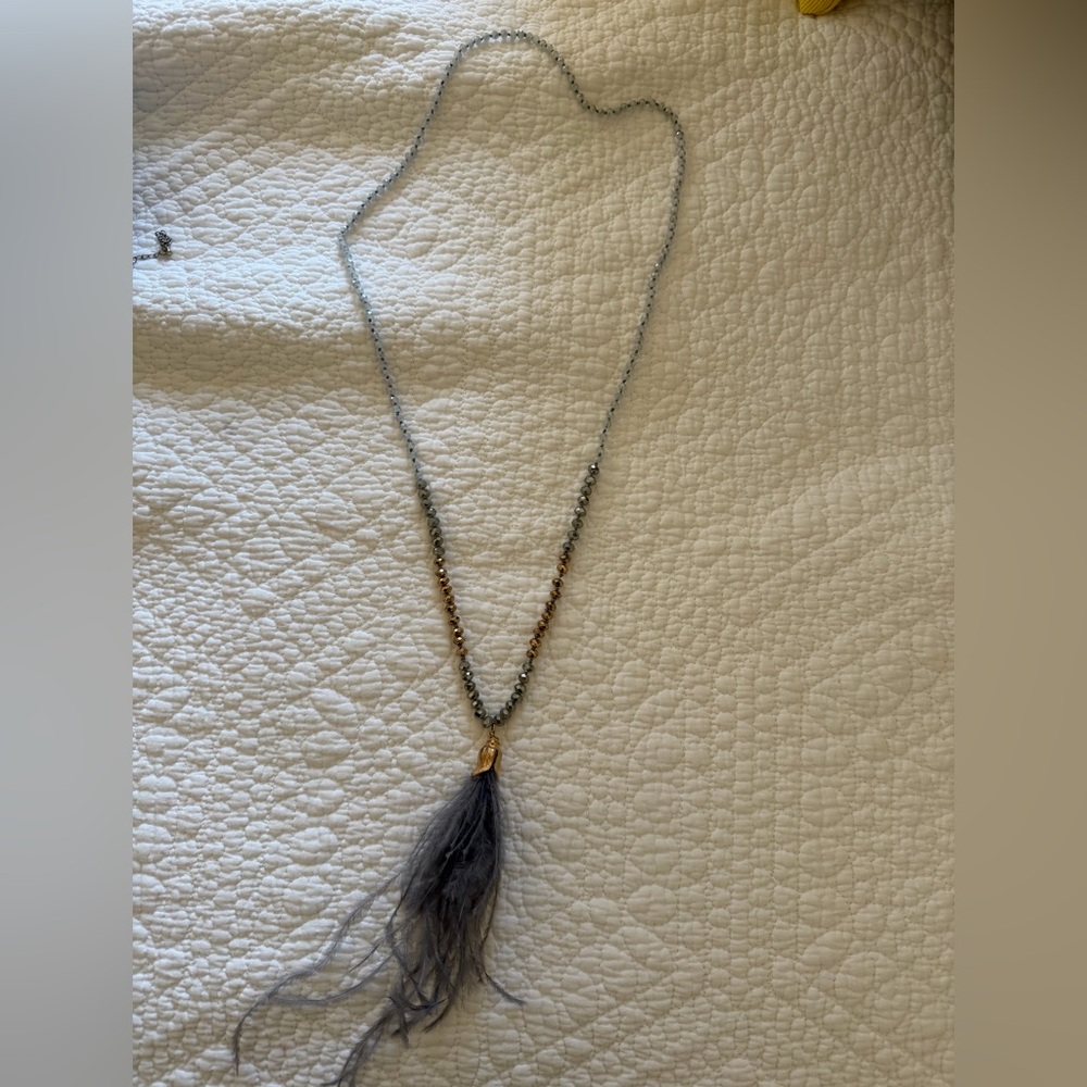 Elegant Gold and Silver Beaded Necklace with Feather Pendant
